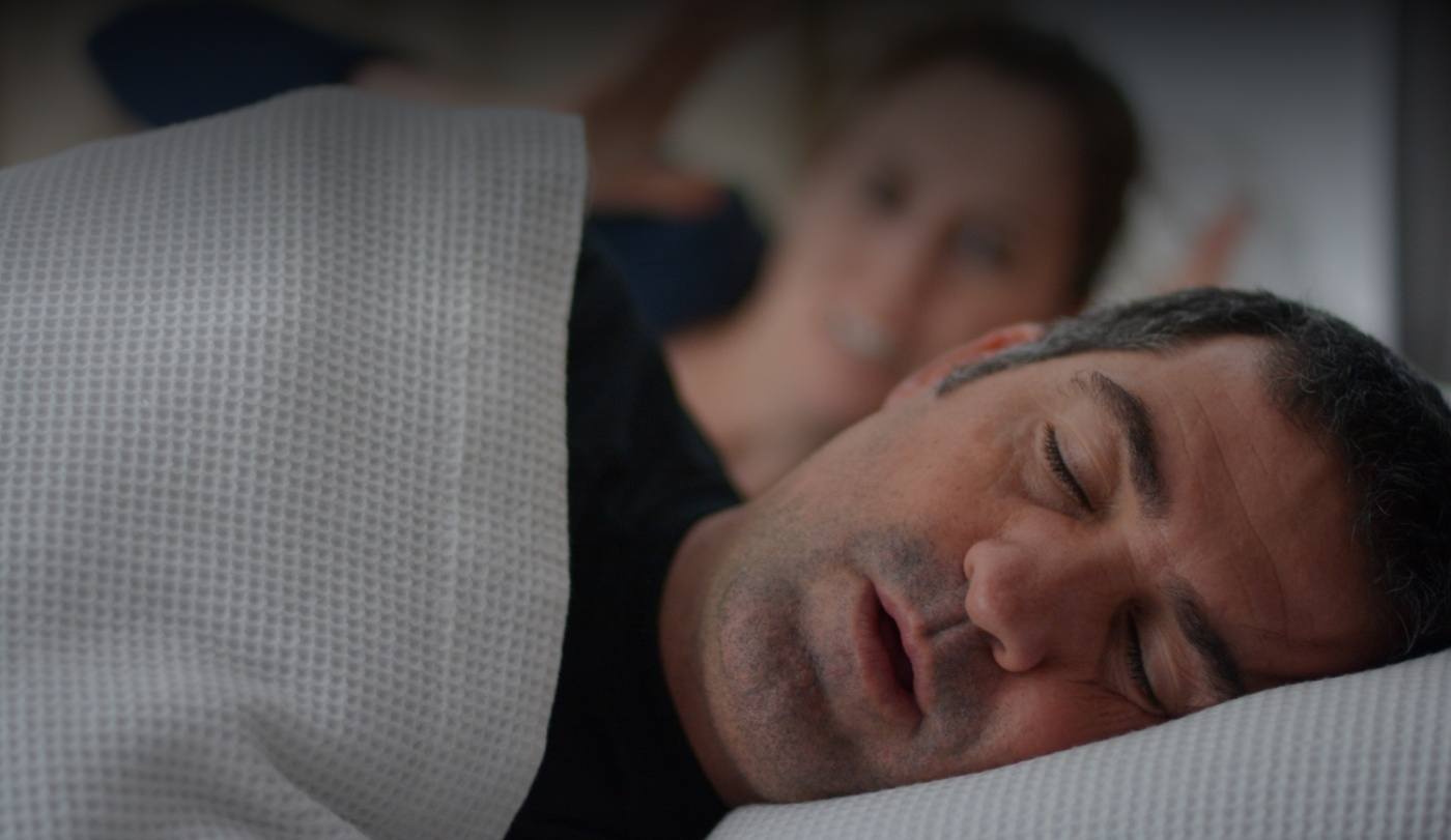 Man with sleep apnea snoring