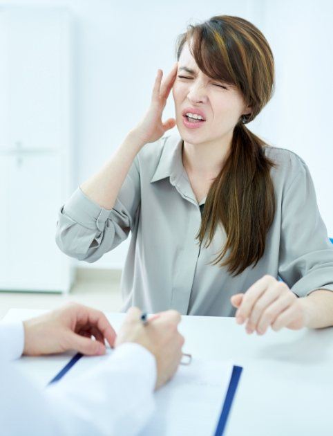 Woman discussing treatment for face and jaw pain