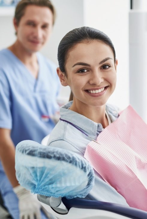 Woman smiling during sleep apnea treatment visit