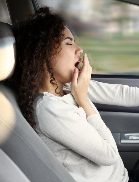 Yawning woman in need of sleep apnea therapy