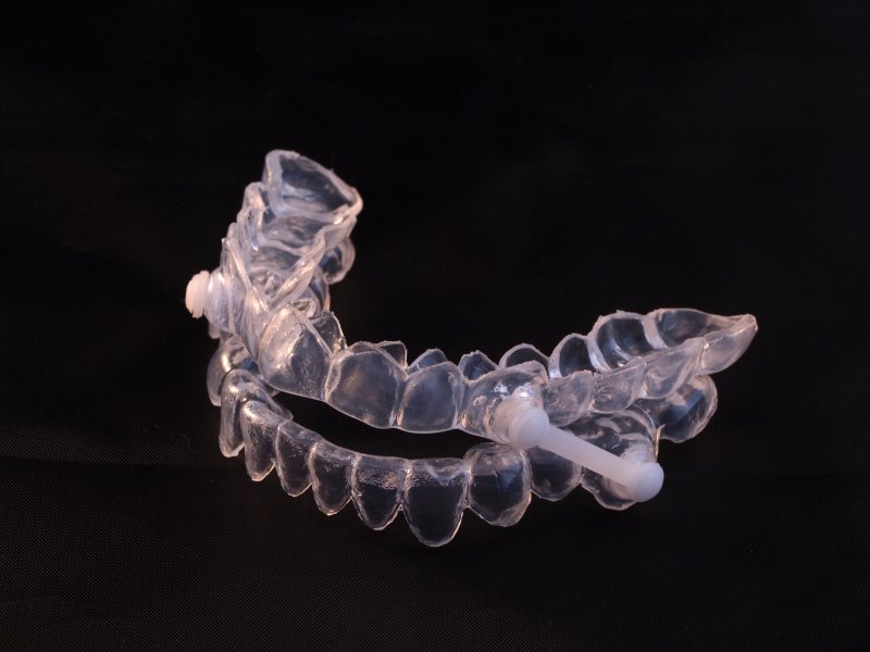 Oral sleep appliance on a black background