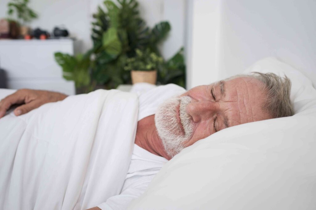 Man sleeping in a bed