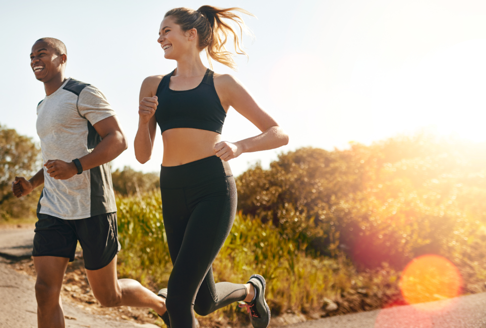 Runners outside on a trail